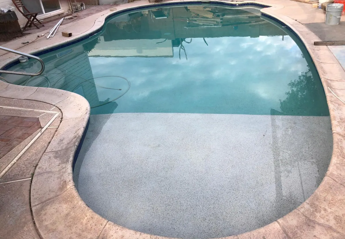 Existing residential pool after a smooth light interior renewal